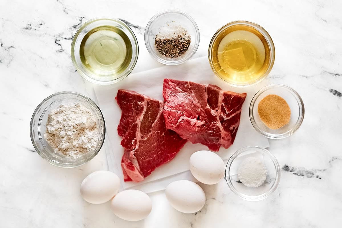 Round steaks, beer, flour, eggs, oil, and seasonings.