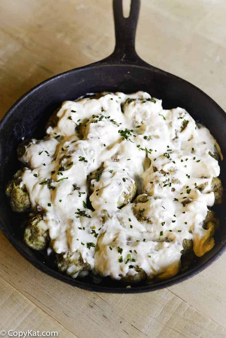meatballs in creamy mushroom sauce in a skillet