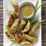 homemade Benihana magic mustard sauce and egg rolls on a platter