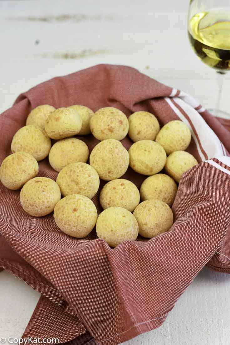 A basket filled with Brazilian cheese bread puffs