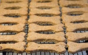 dog bone shaped dog biscuits on a baking rack