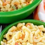 Bowls of homemade macaroni salad with cheese.