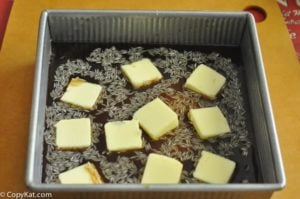 rice, French onion soup, beef consomme, butter, and Worcestershire sauce in a baking dish