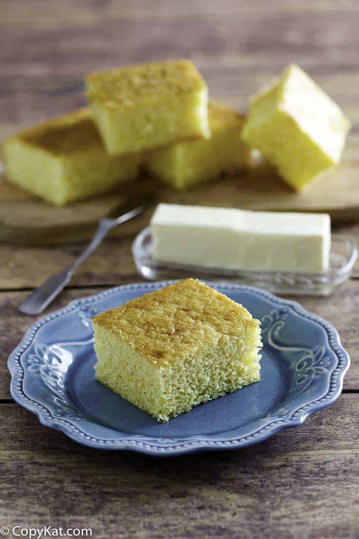 Homemade Boston Market Cornbread slices and a stick of butter