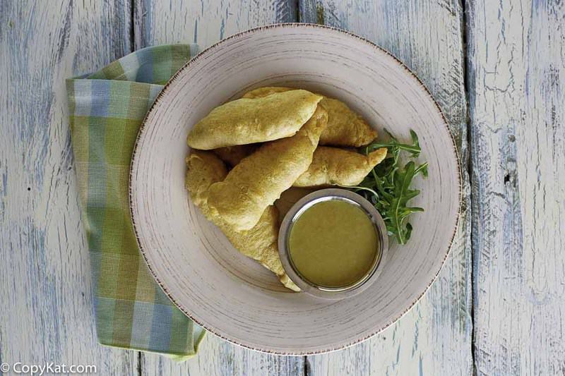 overhead view of homemade Chili's chicken crispers and honey mustard sauce on a plate