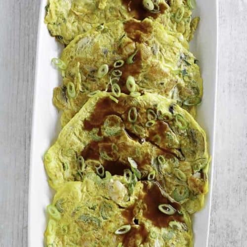 Egg Foo Young with Gravy on a serving platter.