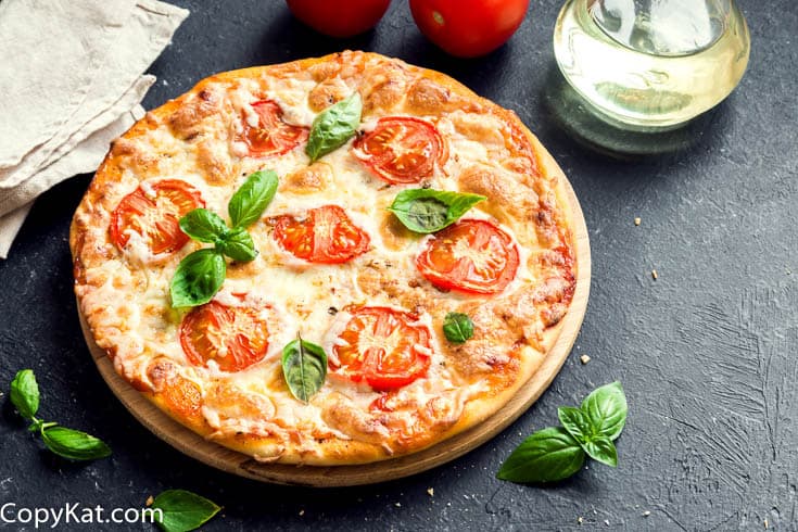 Margarita Pizza on a pizza stone.