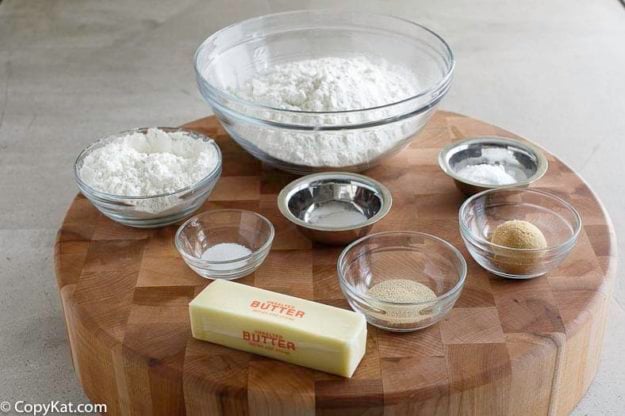 Ingredients for making a soft pretzels; all-purpose flour, bread flour- baking soda, salt, butter, and more.