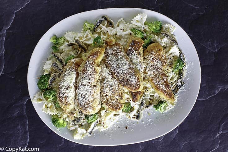 Parmesan chicken tenders and pasta on a platter
