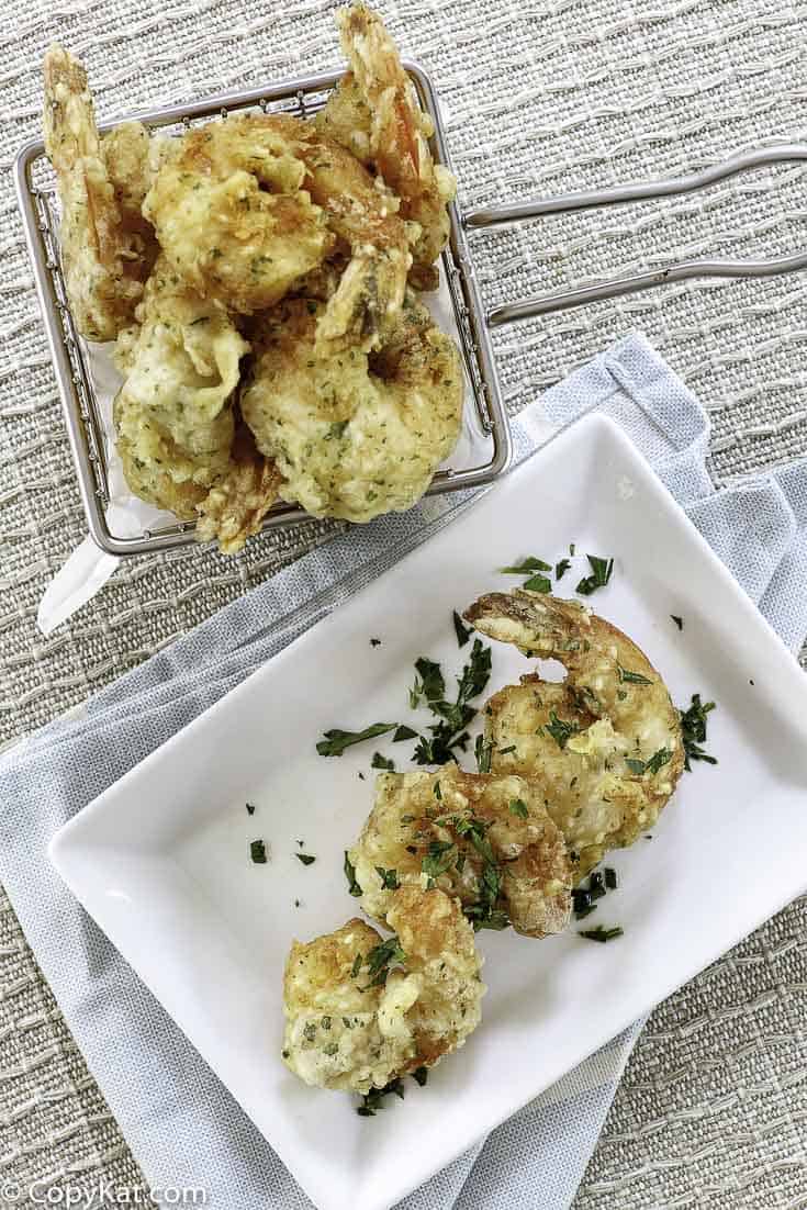 A basket and a plate of homemade shrimp tempura