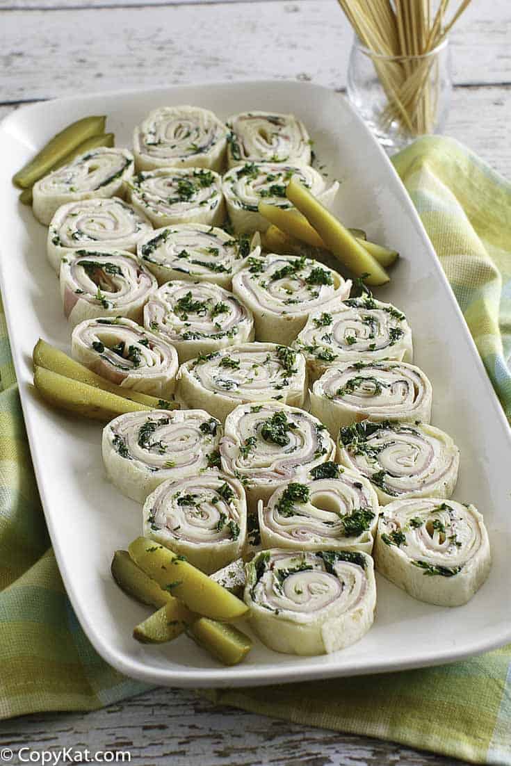 ham and cheese tortilla pinwheel roll ups on a platter