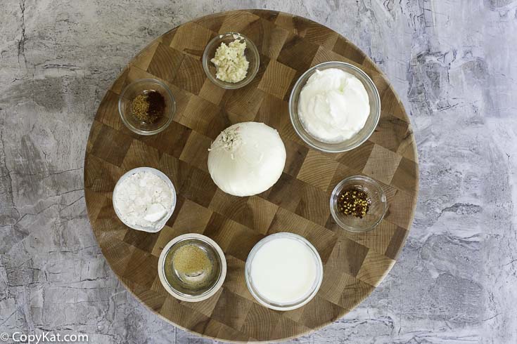 White onion, flour, seasonings, and vegetable oil are the ingredients you will need to make onion petals.