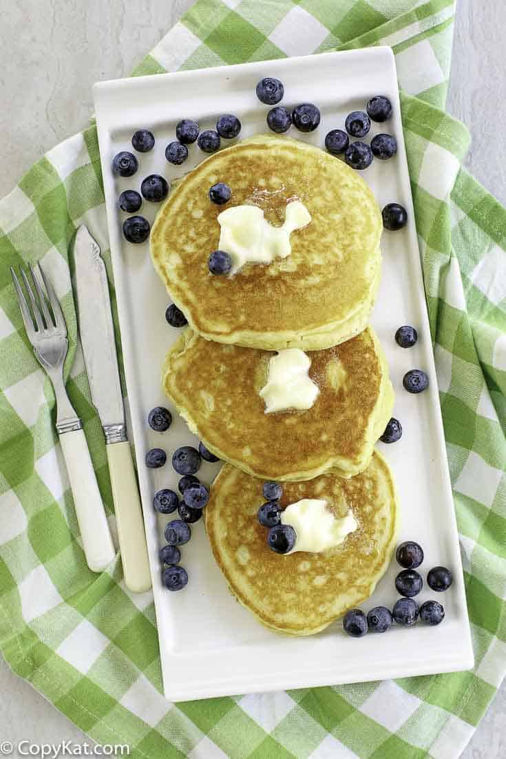 buttermilk pancakes with butter and fresh blueberries
