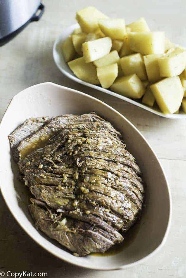 a perfectly seasoned and tender roast beef cooked in a pressure cooker
