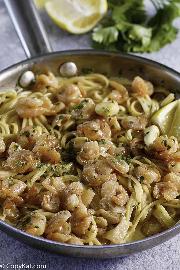 a skillet of garlic shrimp pasta