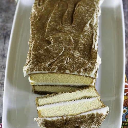 a tiramisu with one slice cut