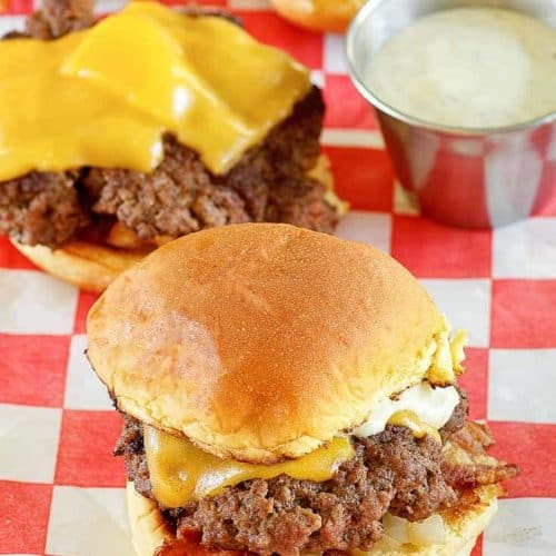 mini hamburger (slider) on red and white checkered parchment paper