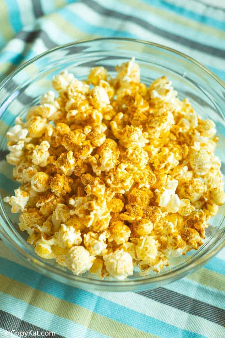 curry popcorn in a glass bowl