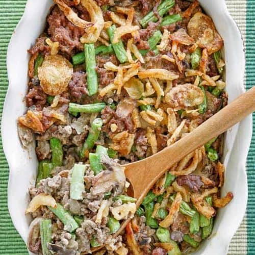 hamburger green bean casserole in a white baking dish