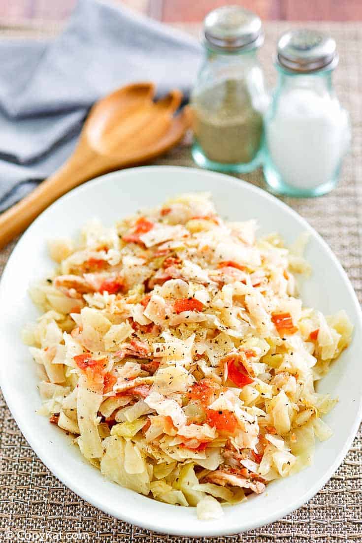 skillet cabbage with bacon on a white platter