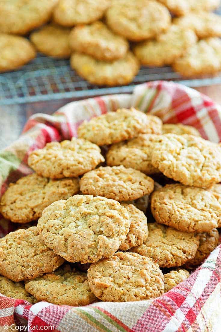 a basket filled with oatmeal coconut crunchies cookies