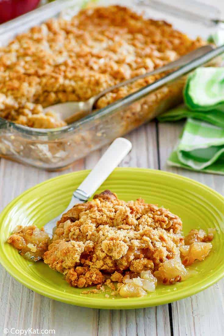 apple crisp in a baking dish and on a plate