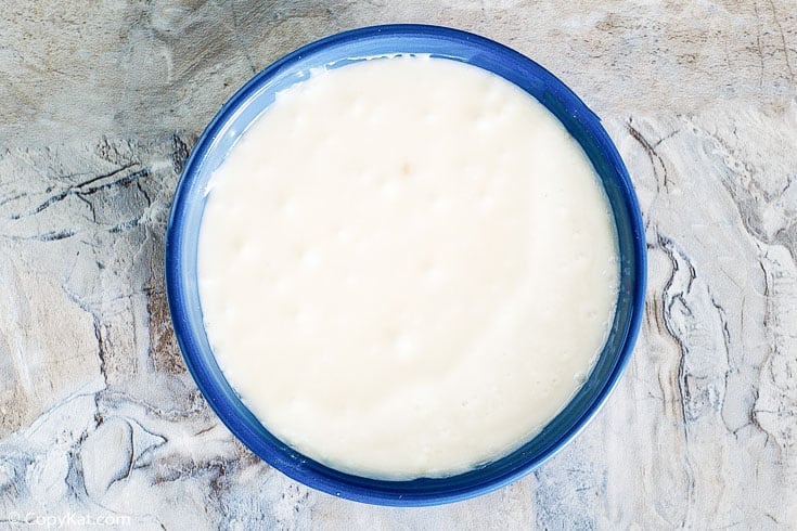 Vanilla Icing dipping sauce in a blue bowl