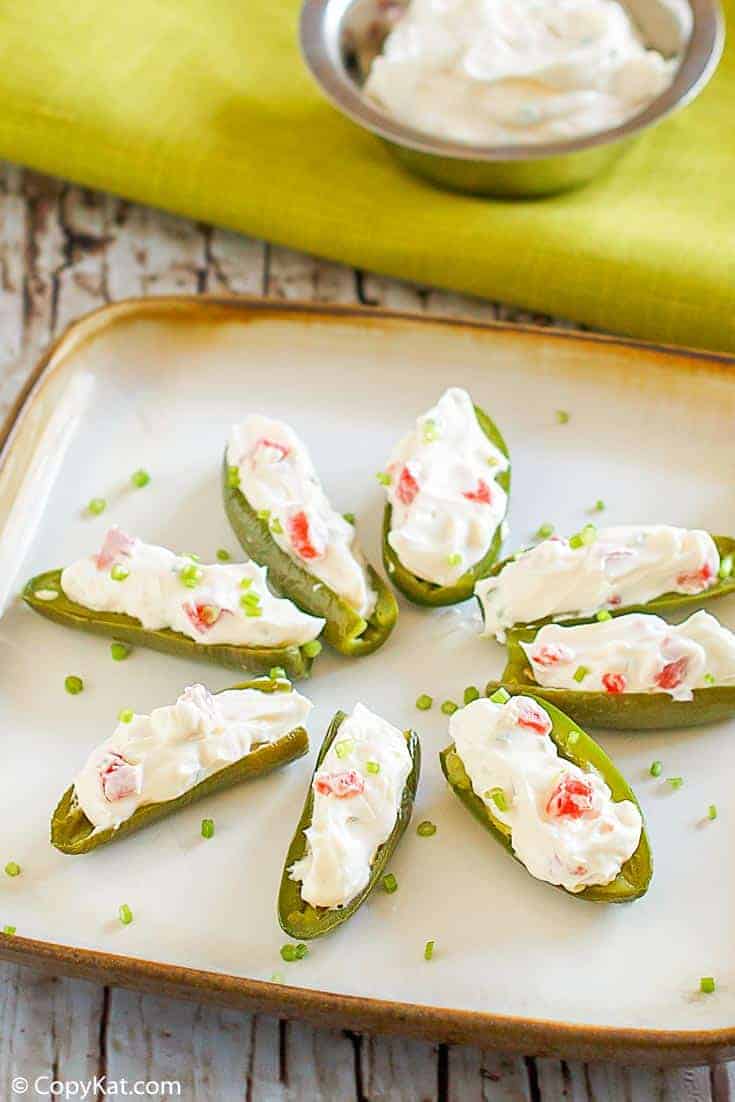 cream cheese filled fresh jalapeno peppers on a plate