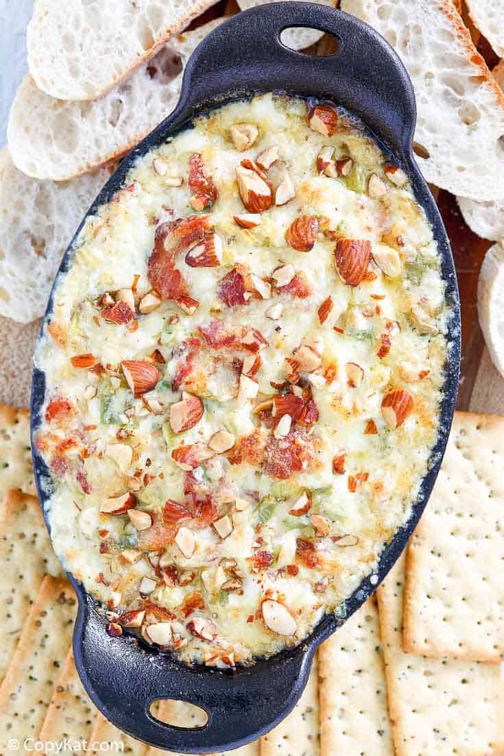 bacon Swiss dip with almonds and crackers