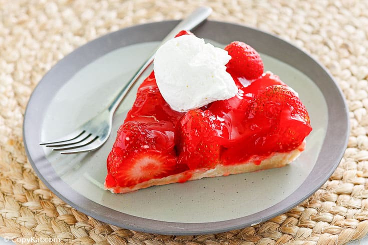 a slice of homemade Big Boy Strawberry pie and a fork on a plate