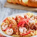 Homemade chicken and shrimp carbonara and bread