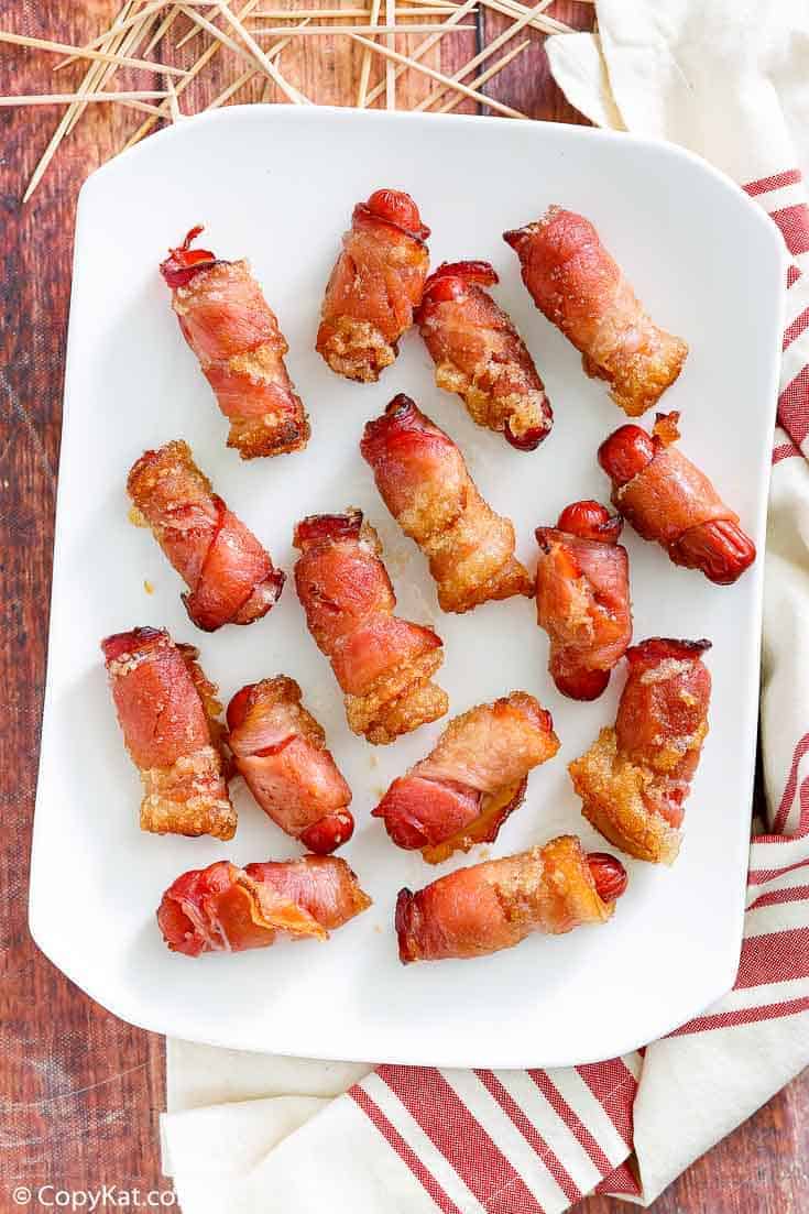 overhead view of bacon wrapped little smokies on a platter