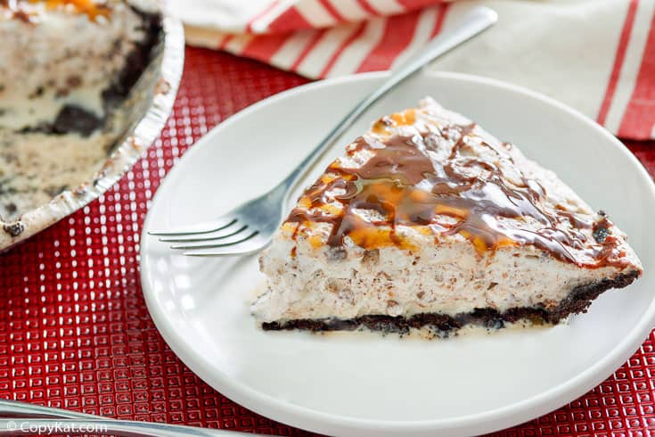 a slice of ice cream pie and a fork on a plate
