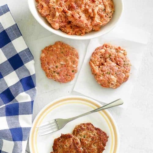 overhead view of homemade Italian sausage in a bowl and patties