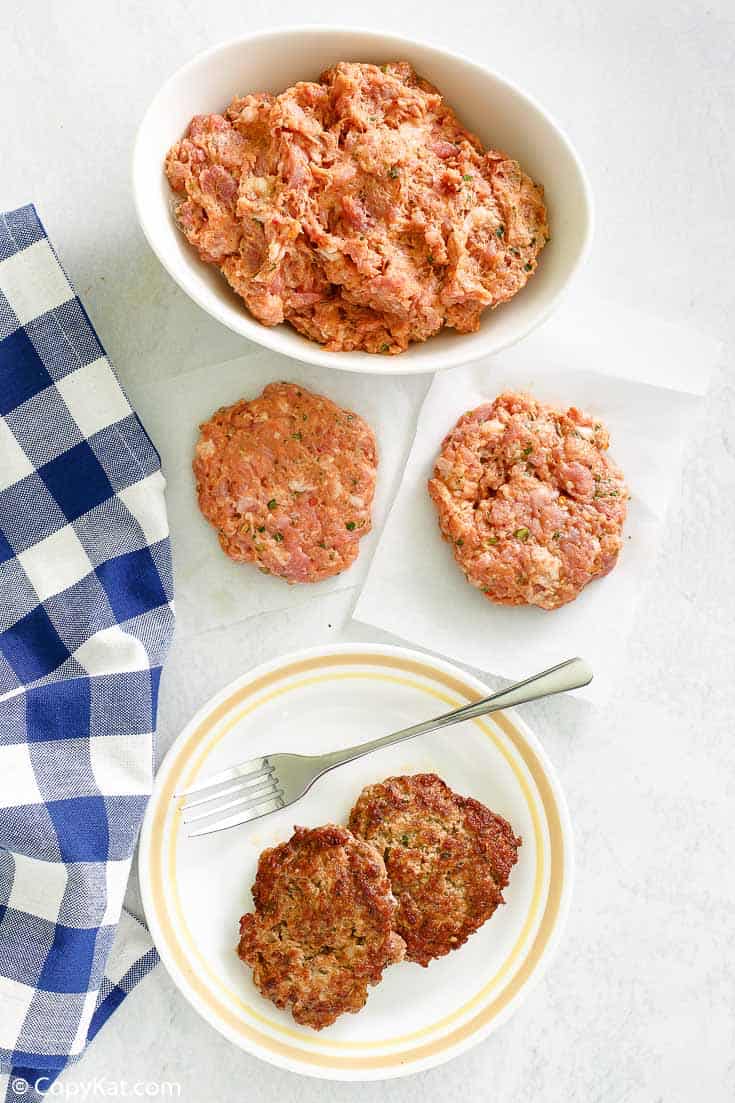overhead view of homemade Italian sausage in a bowl and patties