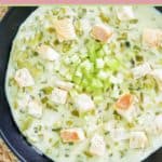 celery soup in a black bowl