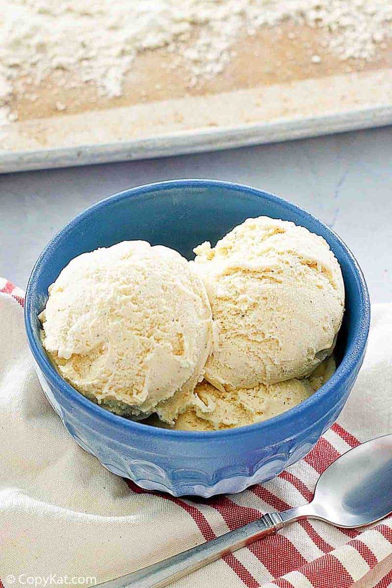 the scoops of cake batter ice cream in a blue bowl