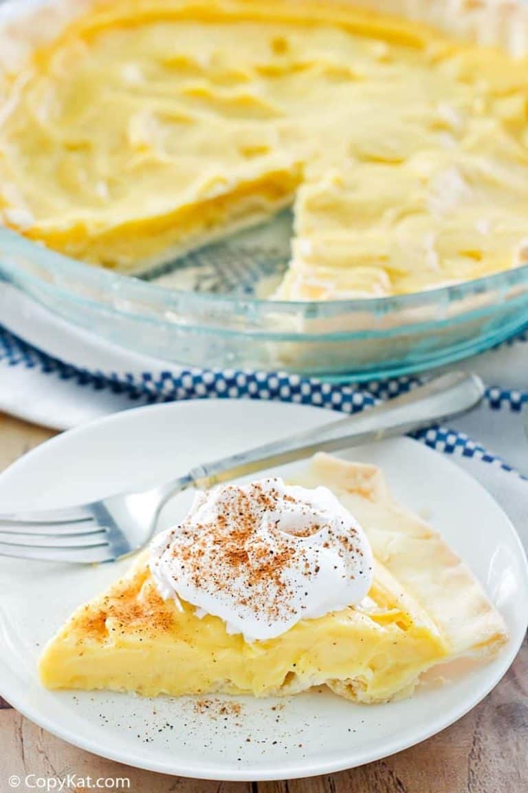 eggnog pie slice on a plate in front of the pie