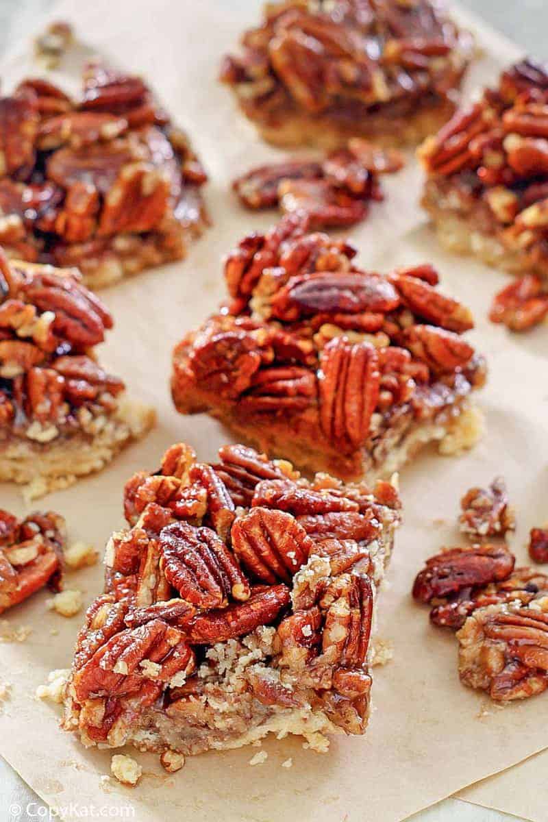 pecan pie bars on parchment paper