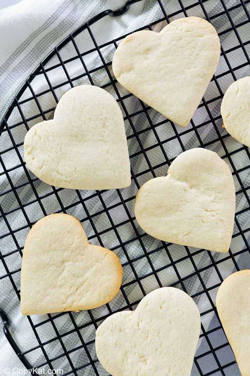 overhead view of heart-shaped cake mix cookies on a cooling rack