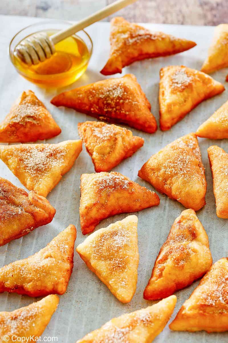 homemade sopapillas and a bowl of honey