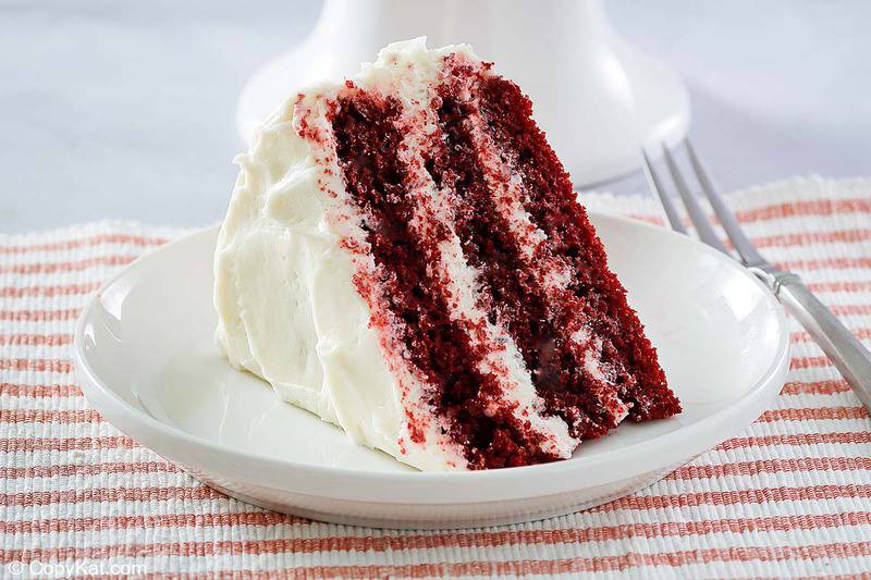 a slice of homemade Waldorf Astoria red velvet cake on a plate