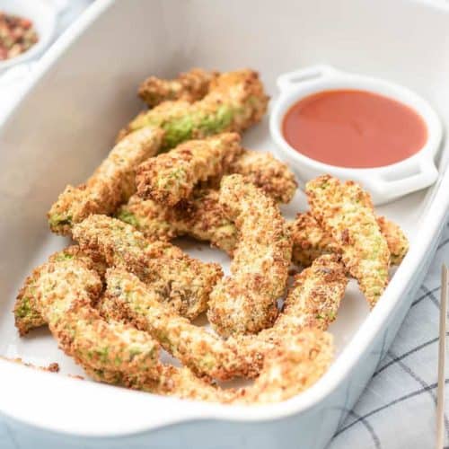 air fryer avocado fries and a bowl of ketchup in a serving dish