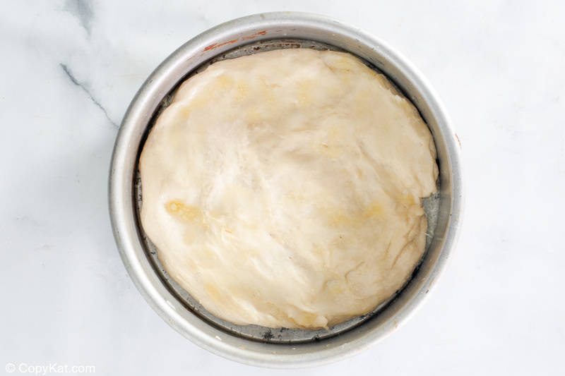 old fashioned coffee cake dough in a cake pan