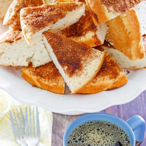 slices of old fashioned coffee cake, two forks, and a cup of coffee