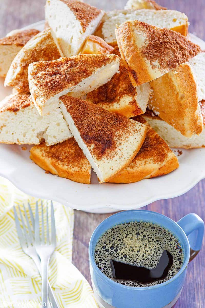 slices of old fashioned coffee cake, two forks, and a cup of coffee