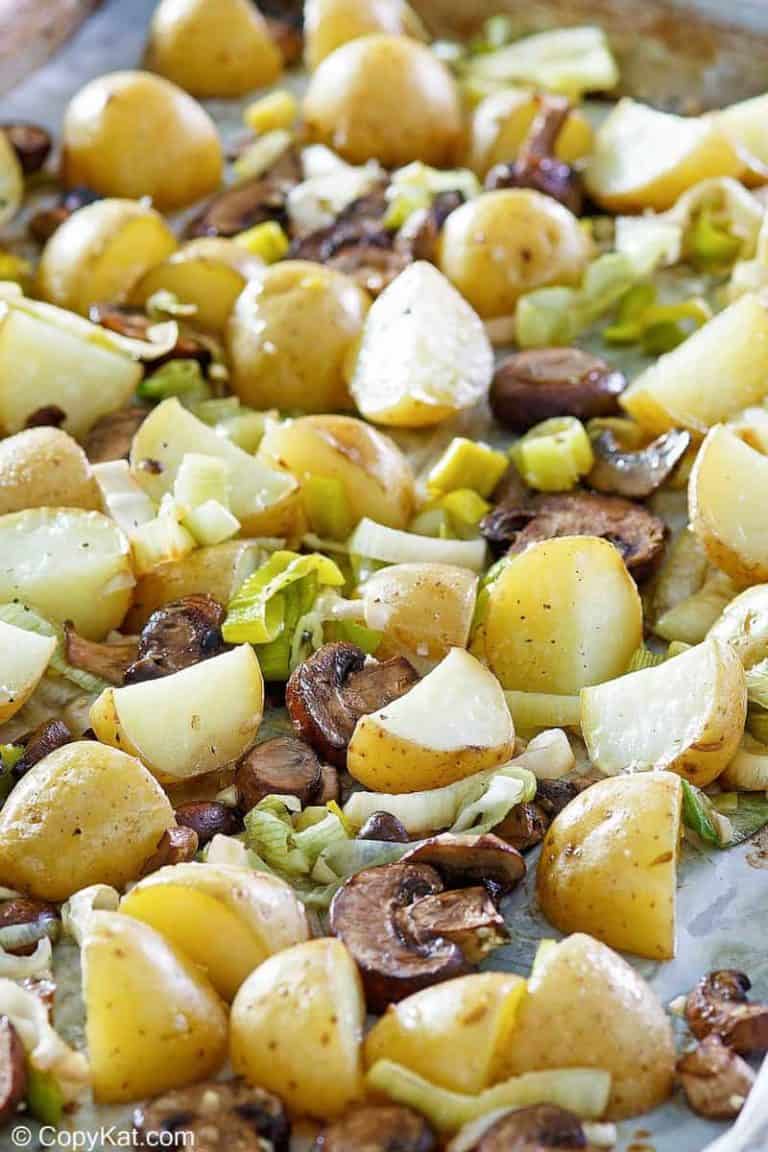roasted leeks, potatoes, and mushrooms on a sheet pan