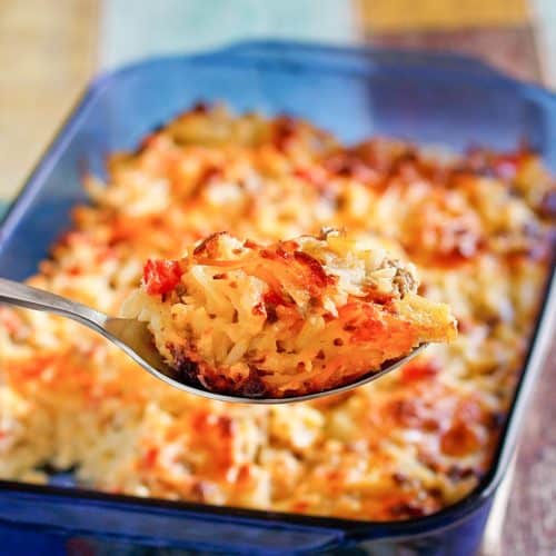 homemade Cracker Barrel loaded hash brown casserole on a spoon