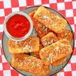 overhead view of homemade TGI Friday's fried mozzarella sticks and marinara sauce