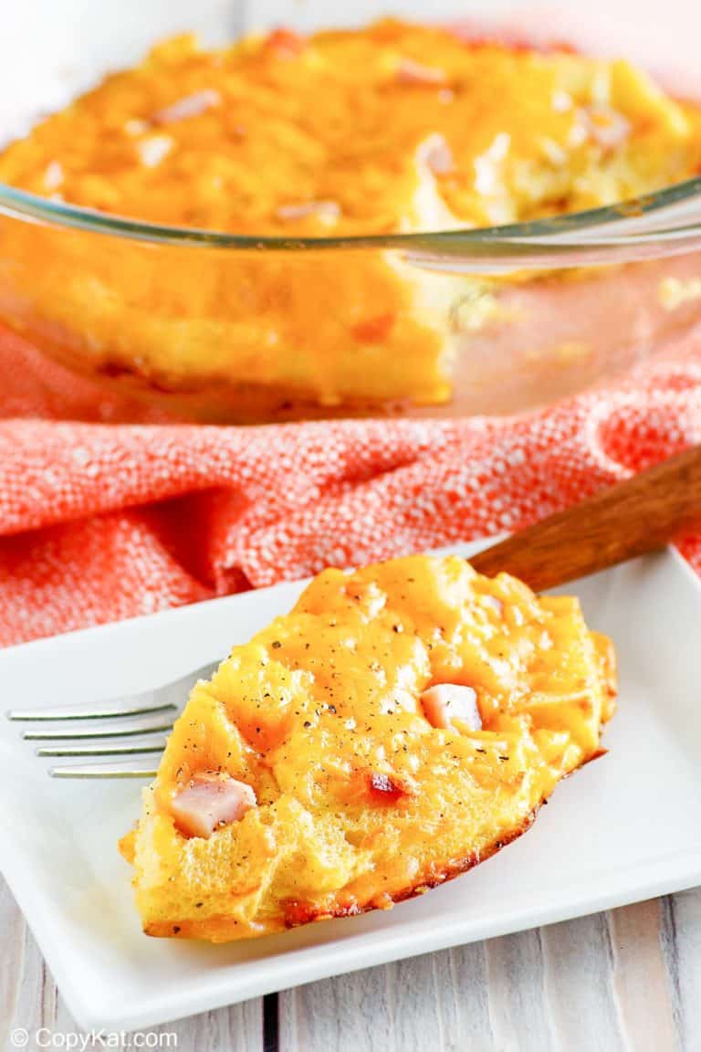 homemade Cracker Barrel ham and egg casserole on a plate and in a baking dish